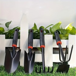Un ensemble de quatre outils de jardinage extérieur comprenant une petite pelle pour la plantation de fleurs, un râteau à cinq